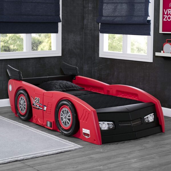 Delta Children Toddler Bed To Twin Bed - Grand Prix Race Car Bed. This 2-in-1 bed transforms from a cozy toddler haven to a spacious twin, featuring a sleek race car design. Made in the USA for safety & built to last!