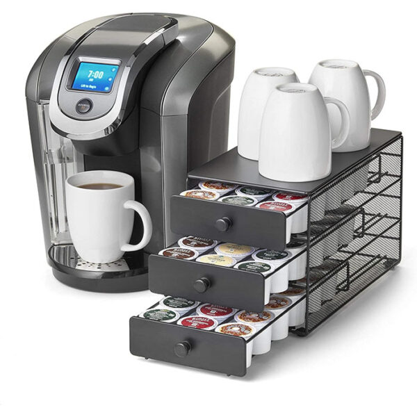 Organize your K-Cups in style with the Nifty Coffee Pod Drawer. This 3-tier drawer offers ample storage, a sleek design, and easy access to your favorite coffee pods. Transform your countertop and elevate your coffee experience.  Black Satin Finish, Compatible with K-Cups, 54 Pod Pack Capacity Rack, 3-Tier Holder & Storage, Stylish Home or Office Kitchen Counter Organizer.