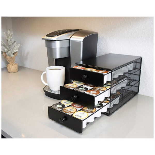 Organize your K-Cups in style with the Nifty Coffee Pod Drawer. This 3-tier drawer offers ample storage, a sleek design, and easy access to your favorite coffee pods. Transform your countertop and elevate your coffee experience.  Black Satin Finish, Compatible with K-Cups, 54 Pod Pack Capacity Rack, 3-Tier Holder & Storage, Stylish Home or Office Kitchen Counter Organizer.